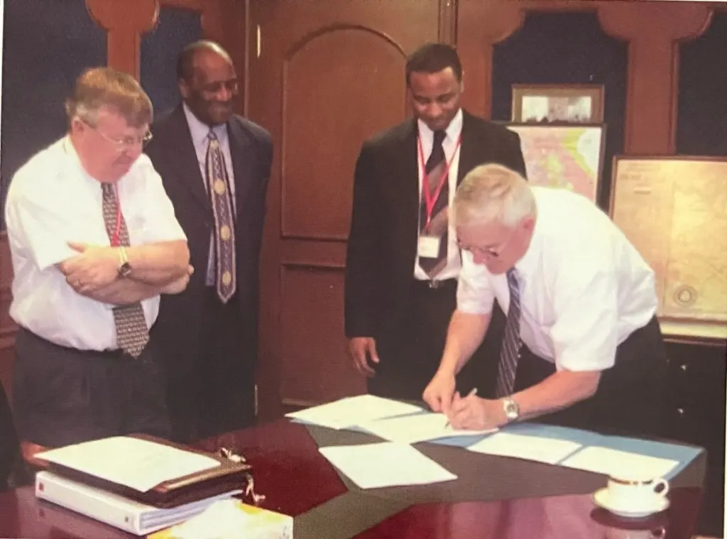 Business leaders completing an international contract signing