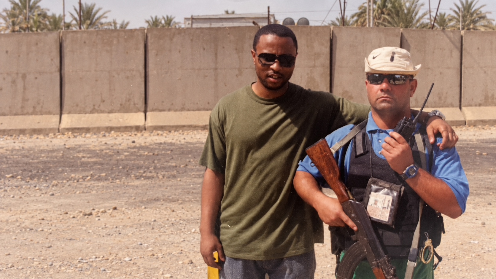 Justin W. Lee with a colleague outdoors during field operations
